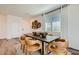 Bright dining room with modern furniture, decor, and natural light from large windows at 9357 Aria Ridge Ave, Las Vegas, NV 89143