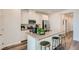 Well-lit kitchen featuring an island, stainless appliances, and white cabinets at 9357 Aria Ridge Ave, Las Vegas, NV 89143