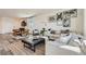 Bright and open living room with stylish decor and a comfortable seating area for relaxing and entertaining at 9357 Aria Ridge Ave, Las Vegas, NV 89143