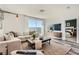 Comfortable living room with a sliding glass door and view of backyard at 9357 Aria Ridge Ave, Las Vegas, NV 89143