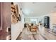 Open-concept living space featuring modern decor and dining adjacent to the kitchen at 9357 Aria Ridge Ave, Las Vegas, NV 89143