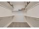 Spacious walk-in closet with ample shelving and storage for organizing clothes and accessories at 9357 Aria Ridge Ave, Las Vegas, NV 89143