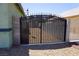 Secure backyard gate with an ornate design that enhances the property's curb appeal at , Las Vegas, NV 89130