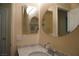 Well-lit bathroom featuring double mirrors, a stylish sink, and granite countertops at , Las Vegas, NV 89130