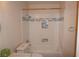 Bathroom with new white tiled shower and blue decorative accent tile at , Las Vegas, NV 89130