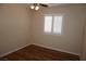 Bedroom showcasing wood floors, window with white shutters, and a ceiling fan at , Las Vegas, NV 89130