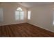 Inviting bedroom with wood-look flooring and plantation shutters on the windows for natural light at , Las Vegas, NV 89130