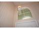 Stylish light fixture hangs near an arched window above the front door, illuminating the foyer at , Las Vegas, NV 89130