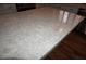 Close up of kitchen island with quartz countertop and wood floors at , Las Vegas, NV 89130