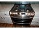 Close up of stainless steel range with white cabinets at , Las Vegas, NV 89130