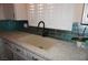Beautiful kitchen sink with modern faucet, countertops, stylish backsplash, and bright window at , Las Vegas, NV 89130