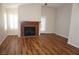 Cozy living room featuring a fireplace with a wooden mantel, and wood-look flooring at , Las Vegas, NV 89130