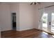 Spacious bedroom with hardwood flooring, ceiling fan, and french doors at , Las Vegas, NV 89130