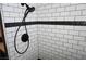 Updated shower showcasing white subway tile with black accent and modern fixtures at , Las Vegas, NV 89130