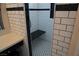 A tiled shower with a built-in bench seat and shower head at , Las Vegas, NV 89130