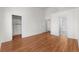 Bedroom with wood floors near a bathroom and closet at 1132 Coral Desert Dr, Las Vegas, NV 89123