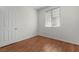 Bedroom with wood floors and a large window, creating a relaxing space at 1132 Coral Desert Dr, Las Vegas, NV 89123