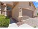 Close-up shot of home exterior, showcasing the front door and two-car garage at 1132 Coral Desert Dr, Las Vegas, NV 89123