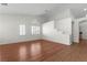 Open living area featuring wood floors, white walls and staircase leading to the upper level at 1132 Coral Desert Dr, Las Vegas, NV 89123