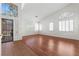 Bright and airy living room featuring neutral walls, wood floors and plenty of windows at 1132 Coral Desert Dr, Las Vegas, NV 89123