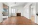 Bright living room featuring tile floors, a fireplace, and sliding doors leading to the outdoor patio at 1132 Coral Desert Dr, Las Vegas, NV 89123