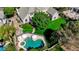 Aerial view of the house displaying a large swimming pool, lush lawn, and an outdoor living area at 1266 Imperia Dr, Henderson, NV 89052