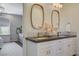 Bright bathroom with dual sinks, granite countertop, and modern mirrors at 1266 Imperia Dr, Henderson, NV 89052