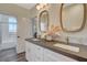 Well-lit bathroom featuring a dual sink vanity, neutral decor, and modern fixtures at 1266 Imperia Dr, Henderson, NV 89052