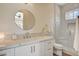 Modern bathroom with a marble countertop, sleek fixtures, and a glass-enclosed shower for a spa-like experience at 1266 Imperia Dr, Henderson, NV 89052