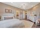 Comfortable bedroom with bright lighting, featuring access to a bathroom and laundry room at 1266 Imperia Dr, Henderson, NV 89052