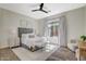 Serene bedroom featuring a plush bed, ample natural light, and a view of a playset, perfect for restful nights at 1266 Imperia Dr, Henderson, NV 89052