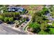 Landscaped entrance of a luxury community features mature trees and immaculate grounds at 1266 Imperia Dr, Henderson, NV 89052