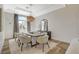 Dining room featuring modern decor, a stylish chandelier, and ample natural light at 1266 Imperia Dr, Henderson, NV 89052