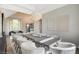 Open dining area with stylish seating, modern light fixture, and view of living space at 1266 Imperia Dr, Henderson, NV 89052