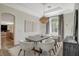 Bright dining room featuring a large table, modern decor, and an open layout at 1266 Imperia Dr, Henderson, NV 89052