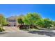 Attractive home with a well-manicured front yard and mature trees at 1266 Imperia Dr, Henderson, NV 89052