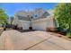 Beautiful stucco home features a three-car garage, large driveway, and gated walkway at 1266 Imperia Dr, Henderson, NV 89052