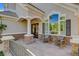 Inviting front entrance with a stone patio, decorative columns, and charming architecture at 1266 Imperia Dr, Henderson, NV 89052