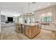 Spacious open kitchen showcasing island, stainless steel appliances, and a view of the living area at 1266 Imperia Dr, Henderson, NV 89052