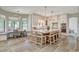 Bright and airy kitchen featuring large island, barstool seating, and modern appliances at 1266 Imperia Dr, Henderson, NV 89052