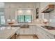 Bright kitchen with marble countertops, stainless steel sink, and modern cabinetry at 1266 Imperia Dr, Henderson, NV 89052