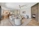 Spacious living room featuring modern decor, fireplace, and large windows at 1266 Imperia Dr, Henderson, NV 89052