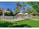 Backyard pool with a safety fence and mature landscaping at 1266 Imperia Dr, Henderson, NV 89052