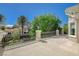 Expansive rooftop terrace with iron railing and serene views of the mature landscaping and neighborhood at 1266 Imperia Dr, Henderson, NV 89052