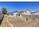 A beautiful backyard with stone landscaping and lots of privacy in a residential neighborhood at 1320 Rainbow Meadows Dr, Las Vegas, NV 89128