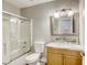 Bathroom featuring a modern vanity, a glass vessel sink, and a shower-tub combo at 1320 Rainbow Meadows Dr, Las Vegas, NV 89128