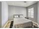 Serene bedroom featuring neutral tones, plush bedding, and large window at 1320 Rainbow Meadows Dr, Las Vegas, NV 89128