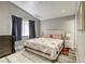 Comfortable bedroom with large bed, neutral colors, and natural lighting from window at 1320 Rainbow Meadows Dr, Las Vegas, NV 89128