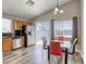 Eat-in kitchen featuring matching appliances, granite countertop and adjacent dining area with table and seating at 1320 Rainbow Meadows Dr, Las Vegas, NV 89128