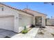 Inviting front entrance with covered porch and view of security door, window and house number at 1320 Rainbow Meadows Dr, Las Vegas, NV 89128